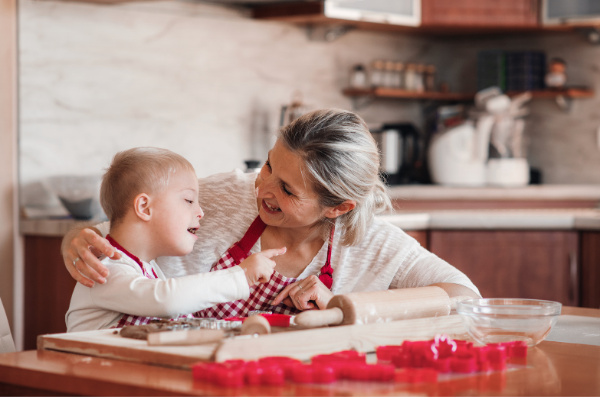 Mom and boy baking together