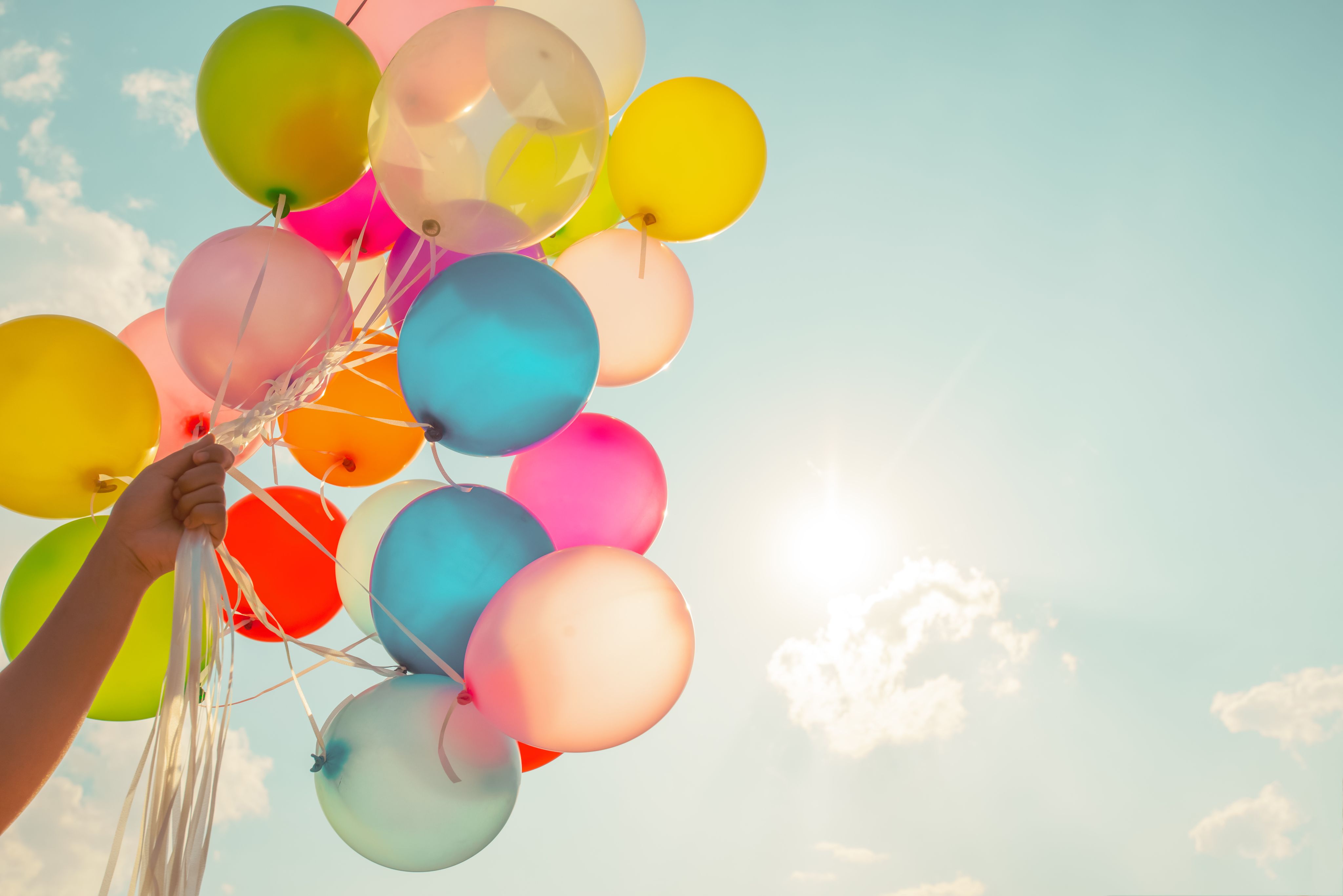 colorful balloons against a clear sky background